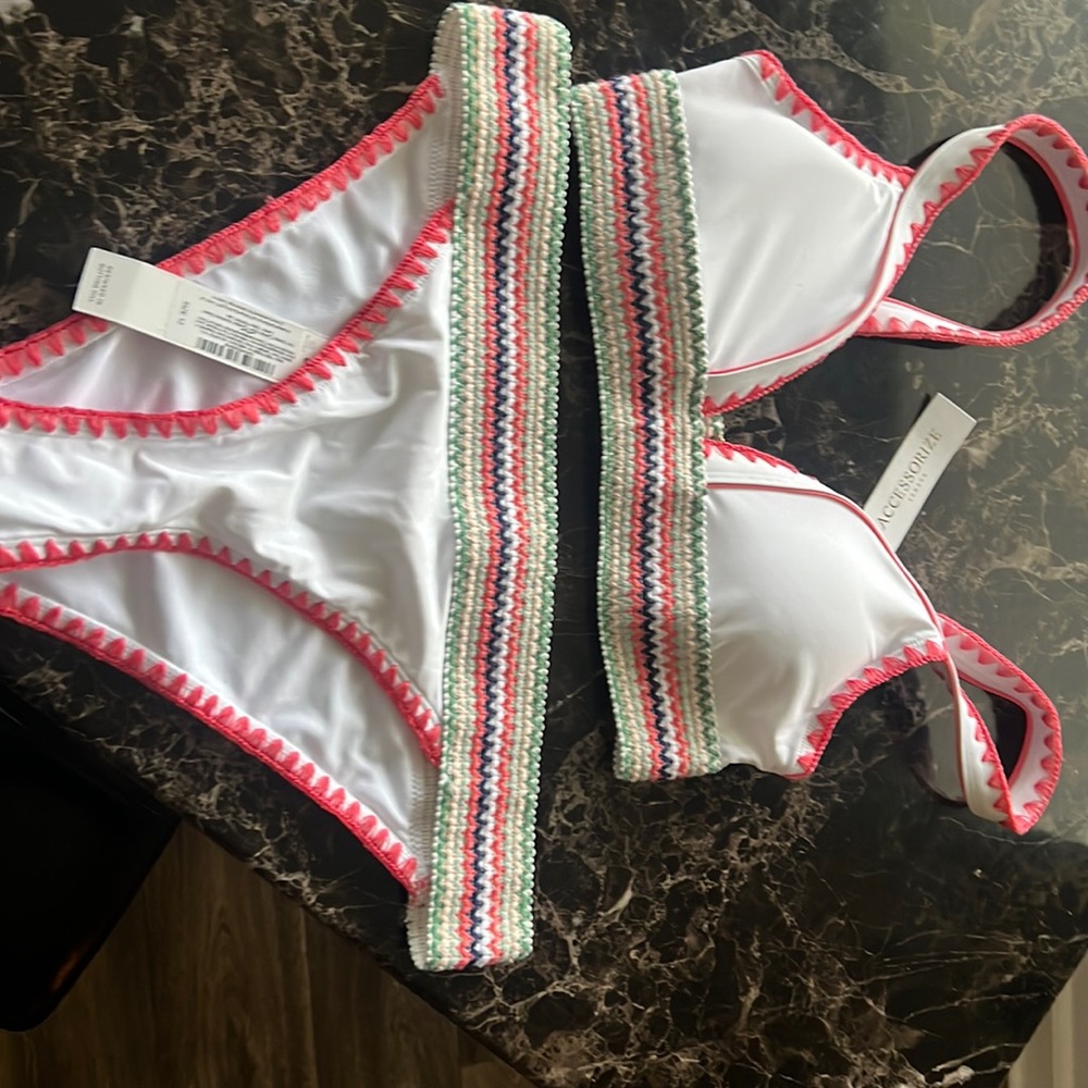 Cute white bathing suit from London. Top is size 10 and bottom size 12